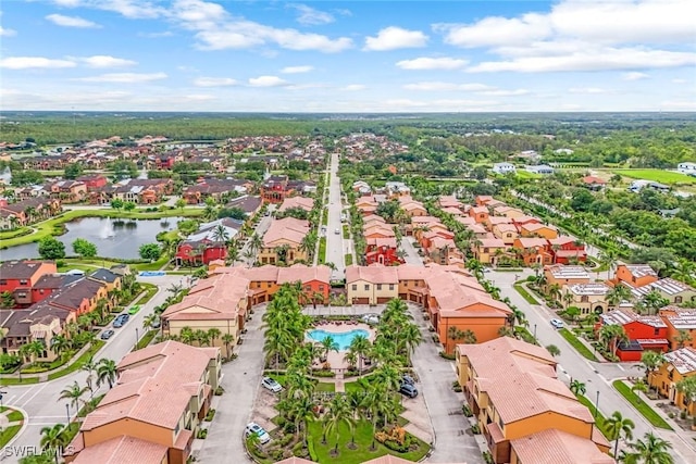 drone / aerial view featuring a water view and a residential view