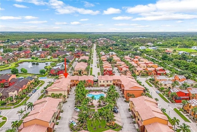 birds eye view of property featuring a water view and a residential view