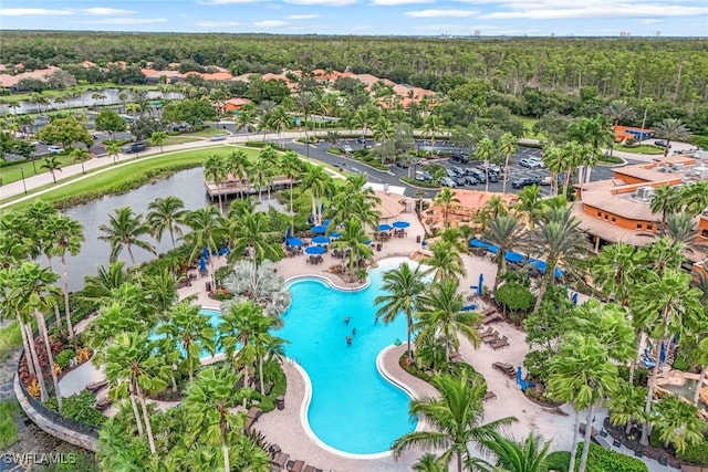 drone / aerial view with a wooded view