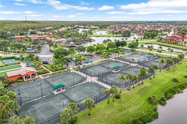 drone / aerial view featuring a water view and a residential view