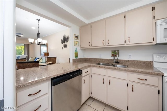 kitchen featuring sink, hanging light fixtures, light tile patterned floors, white appliances, and an inviting chandelier