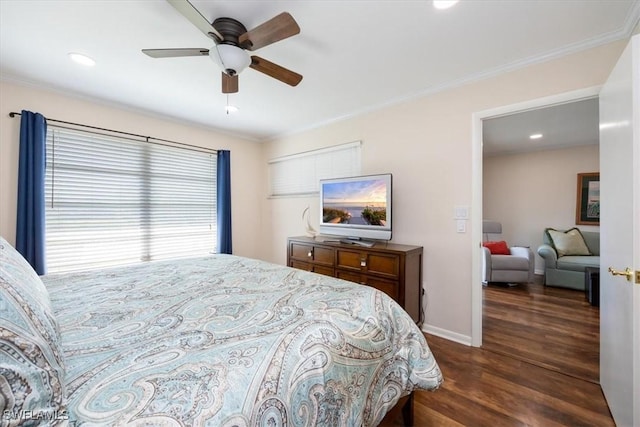 bedroom featuring crown molding, dark wood-type flooring, and ceiling fan