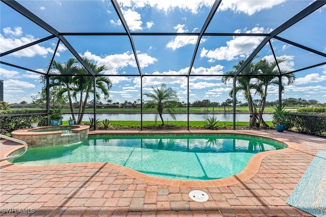 view of pool with a lanai, a patio area, a water view, and an in ground hot tub