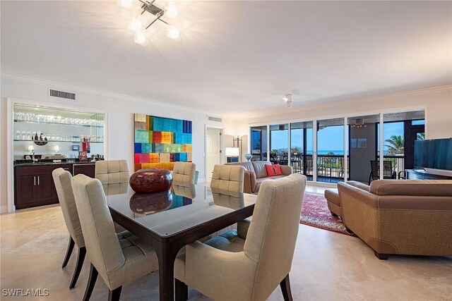 8473 Bay Colony Dr Unit 203, Naples, FL 34108 - dining area featuring crown molding and indoor wet bar
