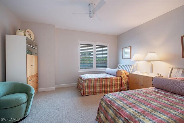 8473 Bay Colony Dr Unit 203, Naples, FL 34108 - bedroom with light carpet and ceiling fan