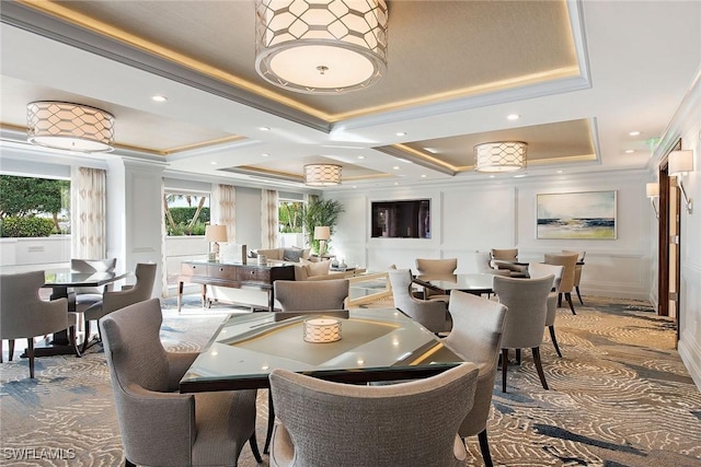 8473 Bay Colony Dr Unit 203, Naples, FL 34108 - dining space featuring a tray ceiling and ornamental molding