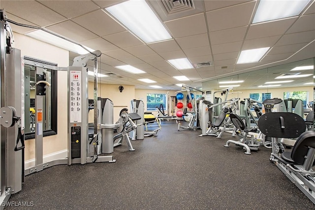 8473 Bay Colony Dr Unit 203, Naples, FL 34108 - exercise room featuring a paneled ceiling