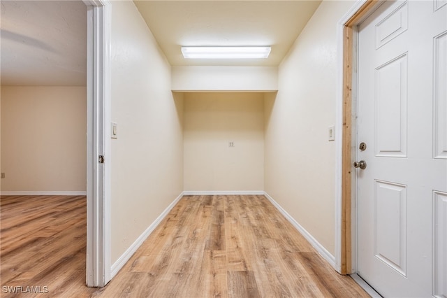 hall with light hardwood / wood-style floors