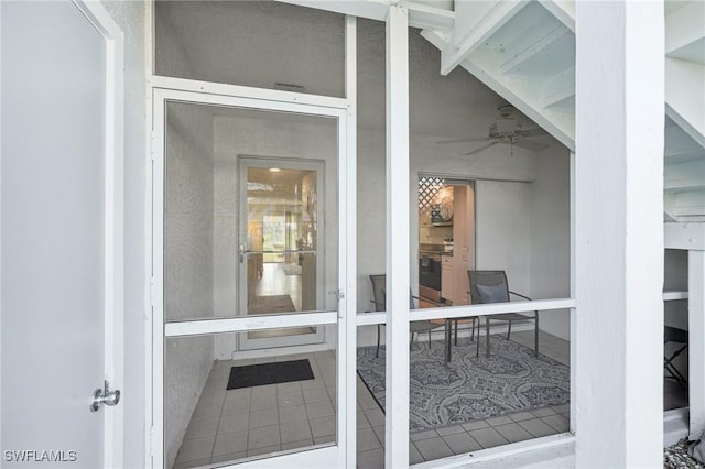 15400 River Vista Dr Unit 301, North Fort Myers, FL 33917 - property entrance featuring a ceiling fan and stucco siding