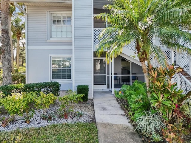15400 River Vista Dr Unit 301, North Fort Myers, FL 33917 - view of exterior entry with stucco siding