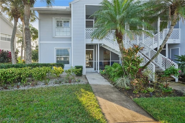 15400 River Vista Dr Unit 301, North Fort Myers, FL 33917 - view of property with a sunroom