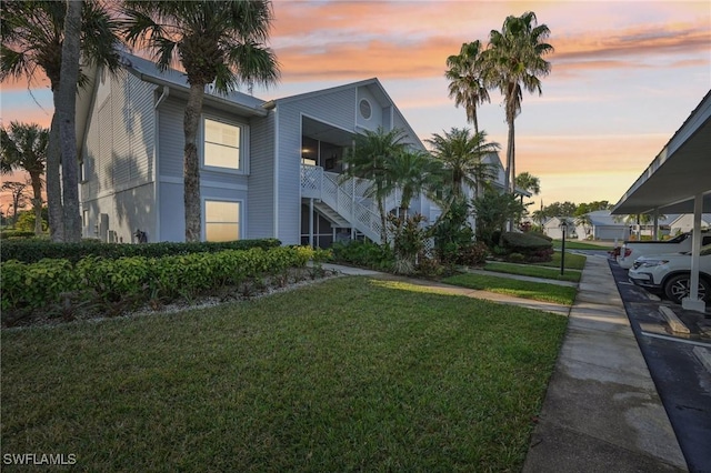 15400 River Vista Dr Unit 301, North Fort Myers, FL 33917 - view of front of house with a front lawn and stairway