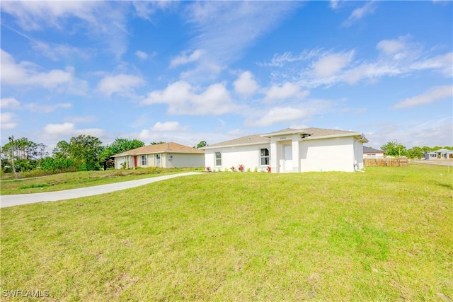 ranch-style house with a front lawn