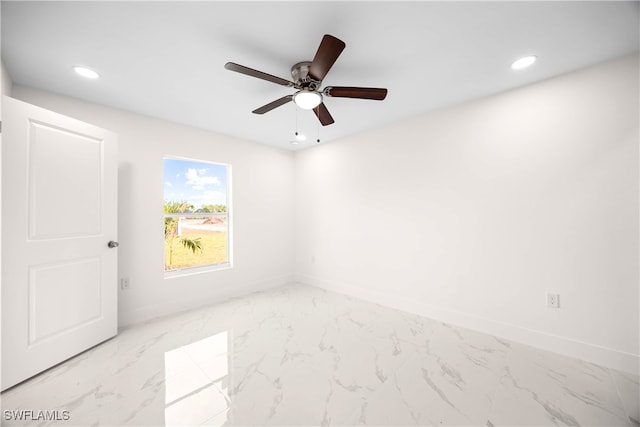 unfurnished room with ceiling fan