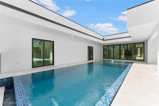 view of swimming pool featuring a patio area