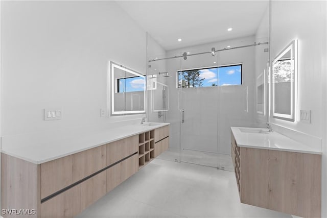 bathroom with walk in shower, vanity, and concrete floors