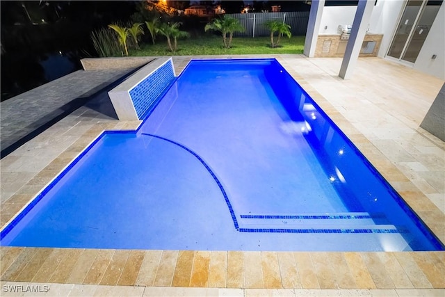 view of pool with a patio and area for grilling