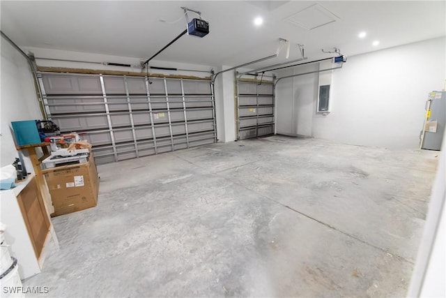 garage with a garage door opener, electric panel, and water heater