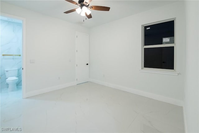 spare room with ceiling fan