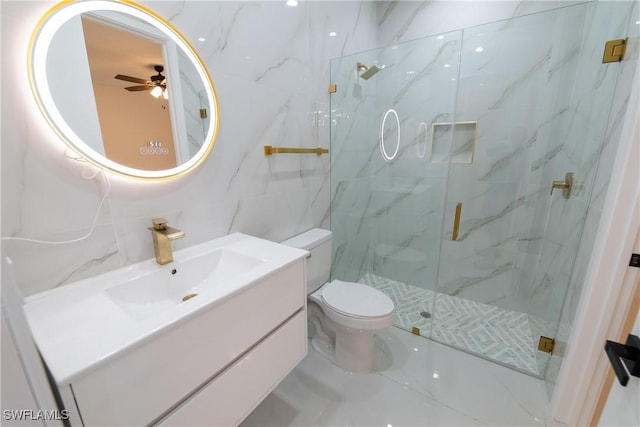 bathroom featuring tile walls, vanity, an enclosed shower, ceiling fan, and toilet