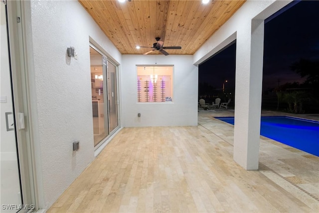 view of pool featuring ceiling fan