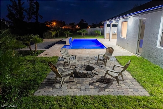 view of pool featuring a patio and an outdoor fire pit