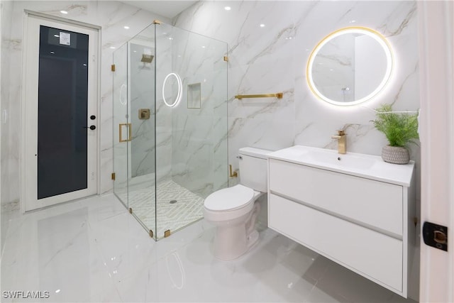 bathroom with vanity, toilet, and a shower with shower door