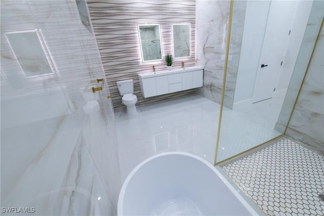 bathroom featuring independent shower and bath, vanity, and tile walls