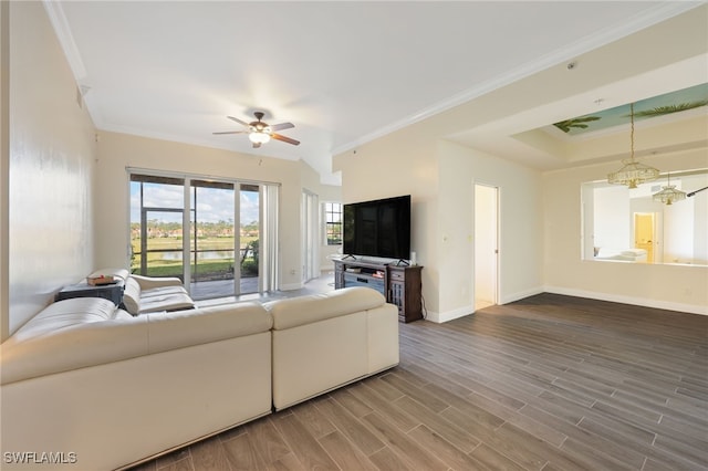 living room featuring crown molding, ceiling fan with notable chandelier, and hardwood / wood-style floors