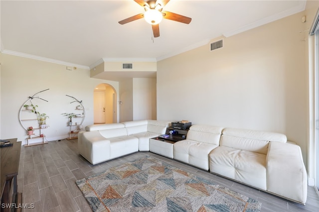 living room featuring crown molding and ceiling fan