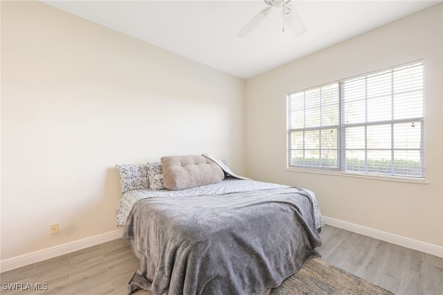 bedroom featuring ceiling fan and light hardwood / wood-style flooring