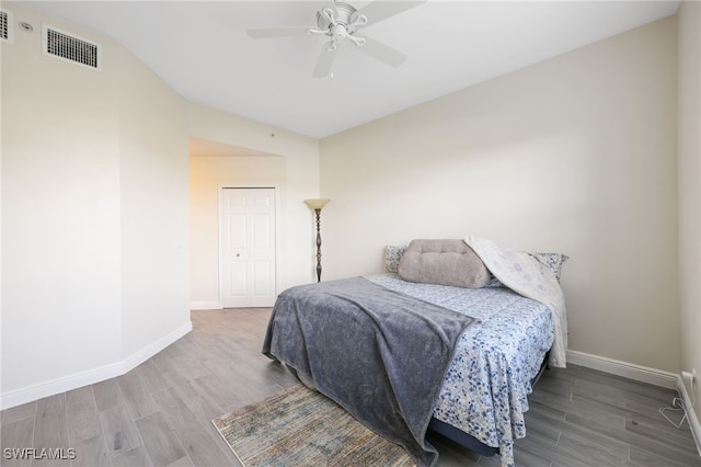 bedroom with hardwood / wood-style floors and ceiling fan