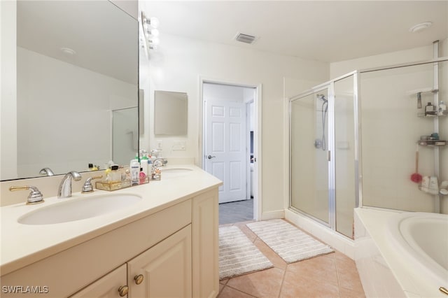 bathroom featuring tile patterned flooring, vanity, and separate shower and tub