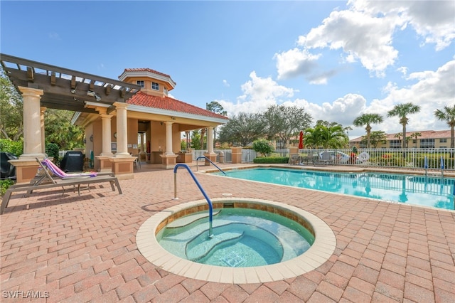 view of pool with a pergola, a patio area, and a hot tub