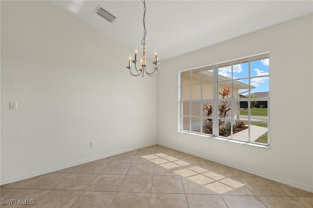 unfurnished dining area featuring light tile patterned floors and a chandelier