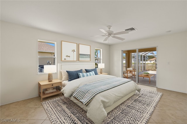 tiled bedroom featuring ceiling fan and access to exterior