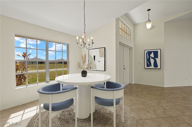 tiled dining area with a chandelier