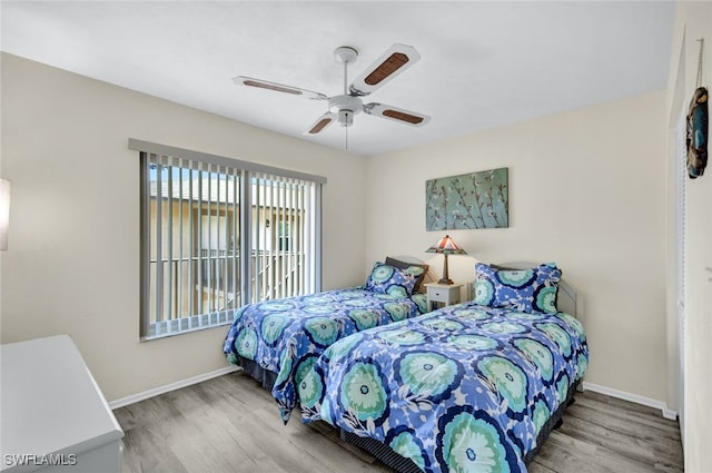 bedroom featuring ceiling fan and hardwood / wood-style floors