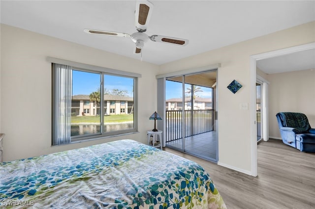 bedroom with ceiling fan, light hardwood / wood-style floors, and access to outside