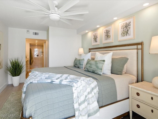 bedroom with hardwood / wood-style flooring and ceiling fan