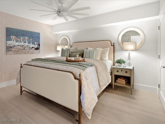 bedroom with ceiling fan and light hardwood / wood-style floors