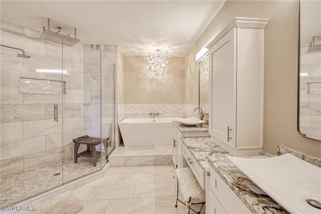 bathroom featuring vanity and separate shower and tub