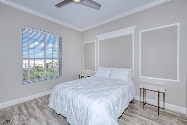 bedroom with crown molding, ceiling fan, and light wood-type flooring