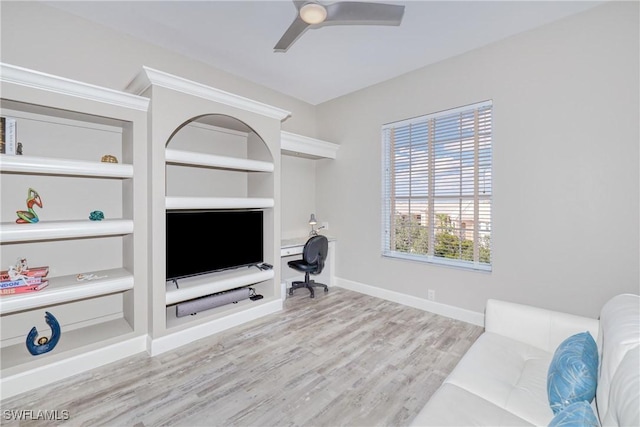 living room with ceiling fan and light hardwood / wood-style floors