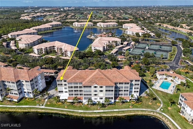 birds eye view of property featuring a water view