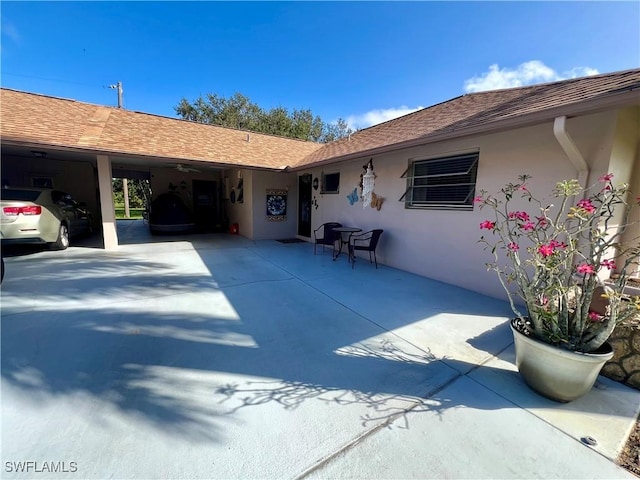 exterior space featuring a carport