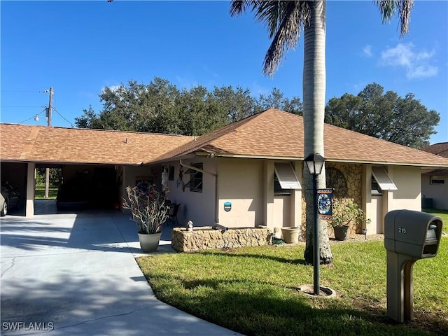 single story home with a carport and a front lawn