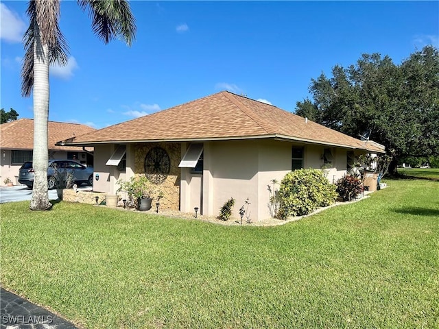 view of side of home featuring a lawn