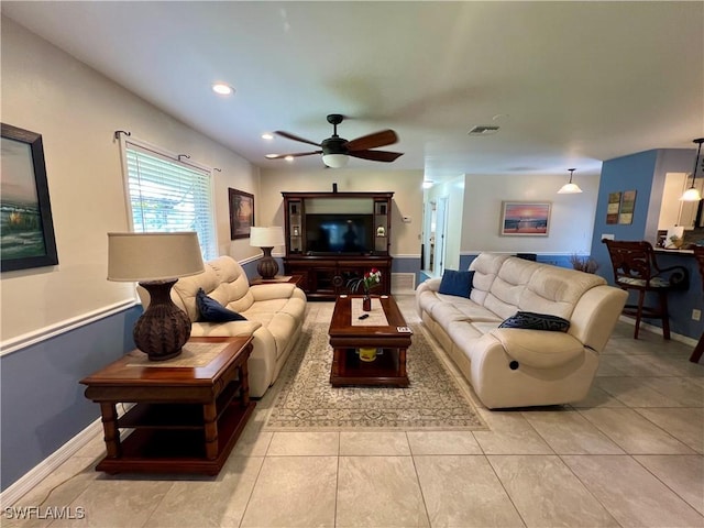 living room with light tile patterned flooring and ceiling fan