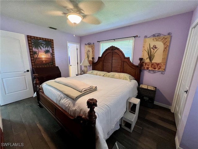 bedroom featuring dark wood-type flooring and ceiling fan